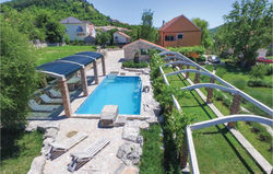 Four-Bedroom Holiday Home in Sinj