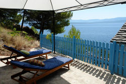 A small stone house by the sea, in a wineyard