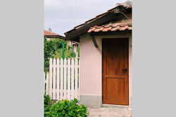 Cute Little House with a White Picket Fence